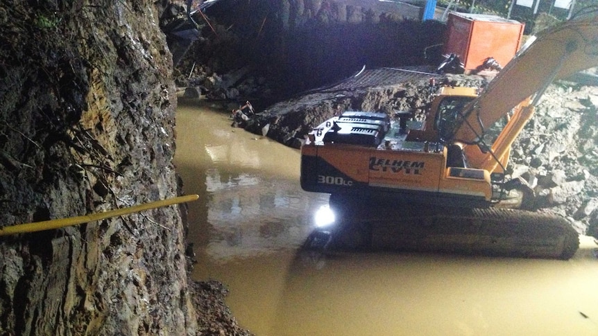 A building site full of water after a wall collapse at Collaroy on Sydney's northern beaches.