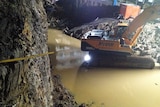 A building site full of water after a wall collapse at Collaroy on Sydney's northern beaches.