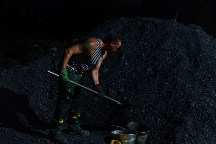 A man shoveling coal