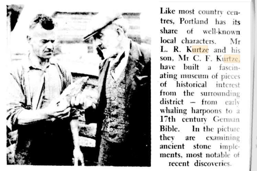 Historic newspaper article with photo picturing two men holding blurred objects
