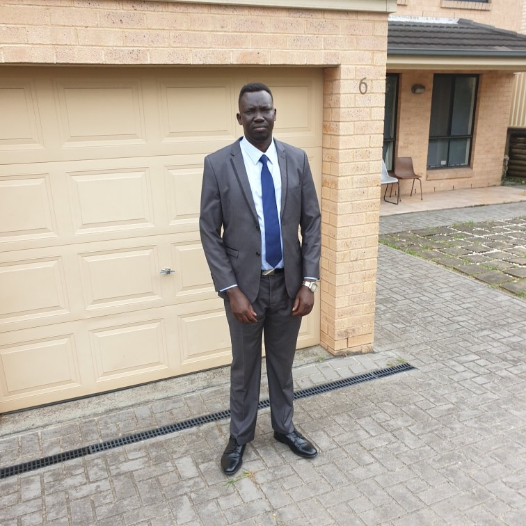 Young black man in a suit.