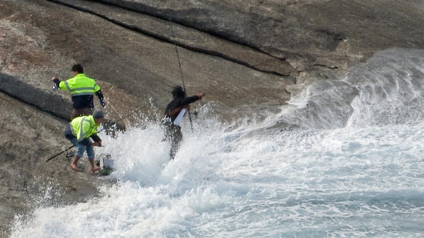 Huge wave washes onto fisherman on rocks at Salmon Holes