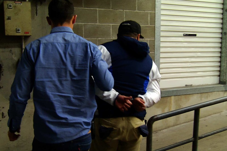 Man taken into custody after police conducted raids around western Sydney.