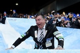 Collingwood president Eddie McGuire takes part in Big Freeze ice slide at the MCG on June 13, 2016.