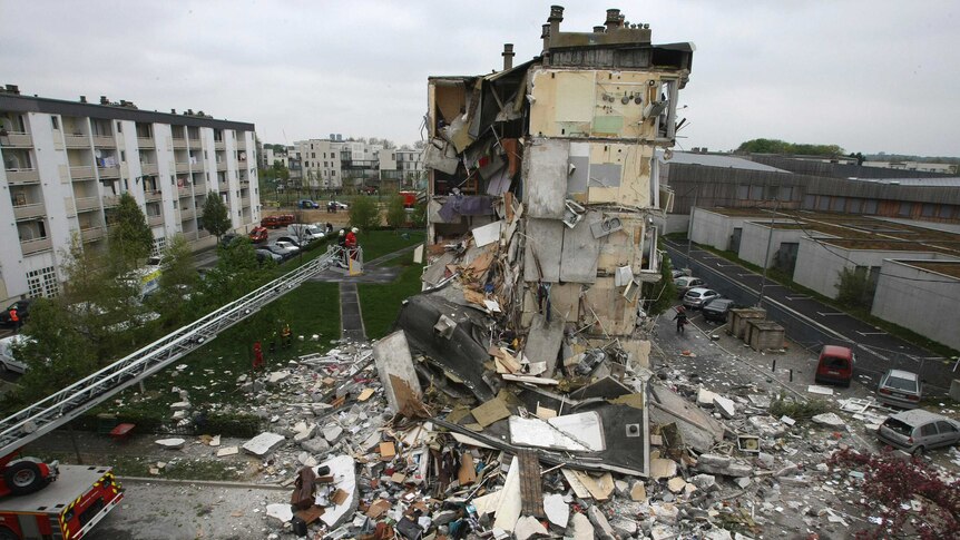 French rescue forces surround collapsed residential building