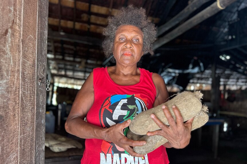 A woman with yams for a feast
