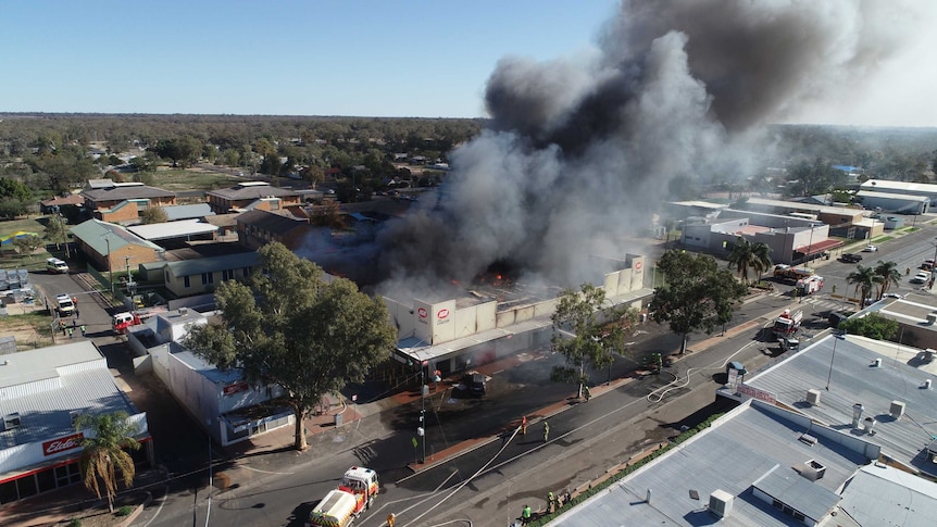 Drone photo shows thick black smoke surrounding the supermarket.