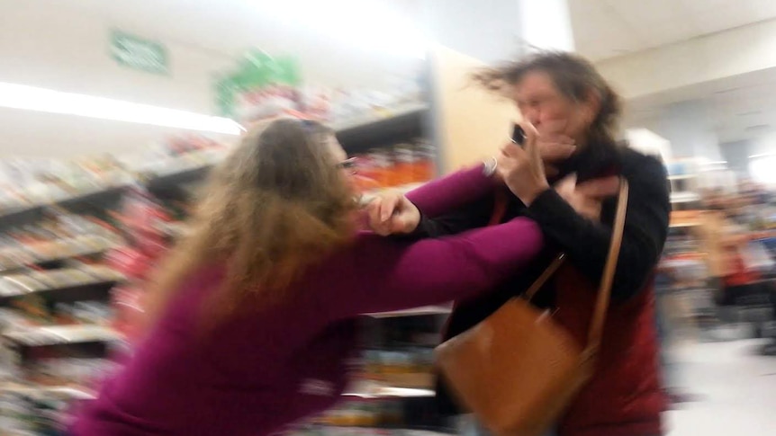 Two women brawling in a Walmart store.