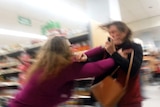 Two women brawling in a Walmart store.