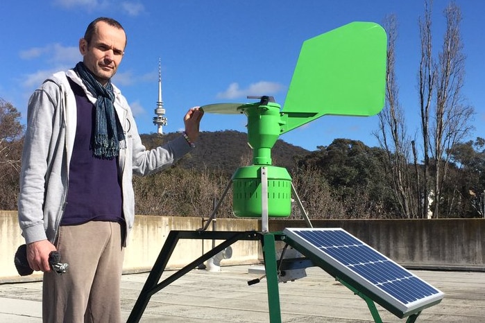 Research Associate Ben Keaney standing next to a pollen monitor at Australian National University, September 2016.