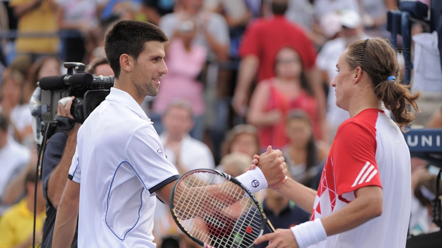 Novak Djokovic admitted Alexandr Dolgopolov (r) had him out-of-sorts in the first set tiebreak.