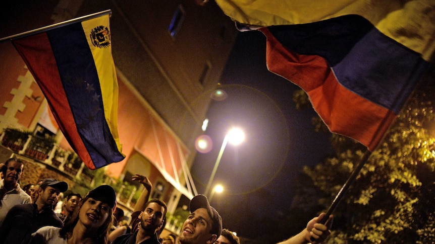 Venezuelan opposition supporters celebrate.