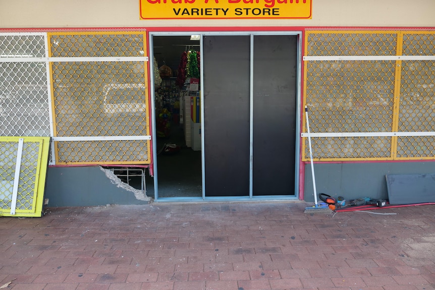 broken shop door half way through being repaired