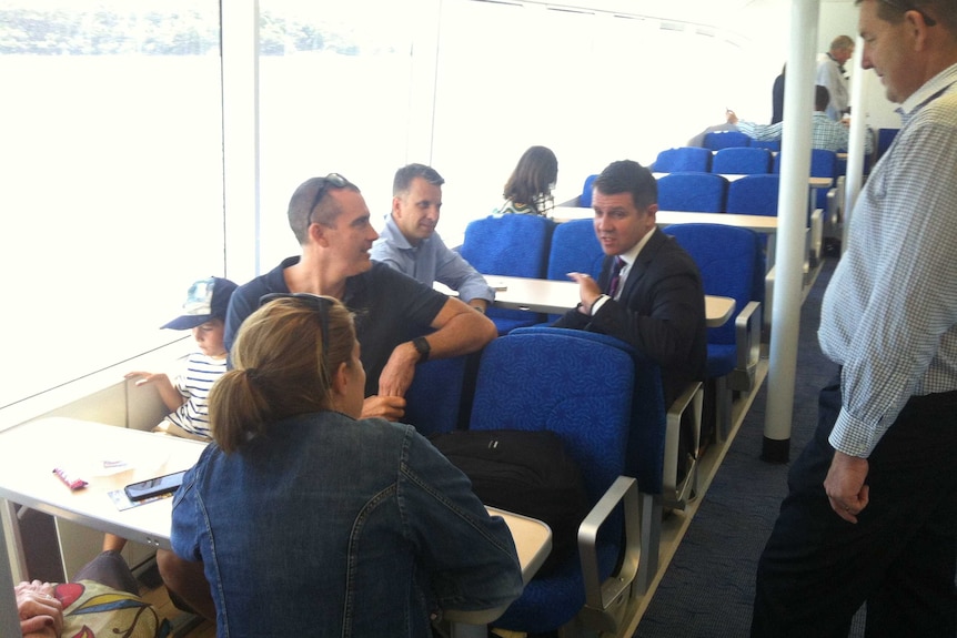 Premier Mike Baird chats to passengers aboard one of the new Manly ferries