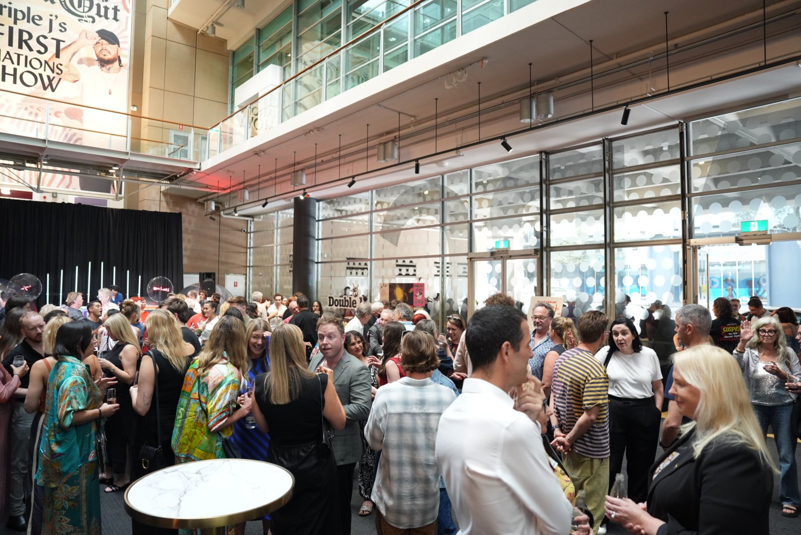 A large crowd of people in a room.