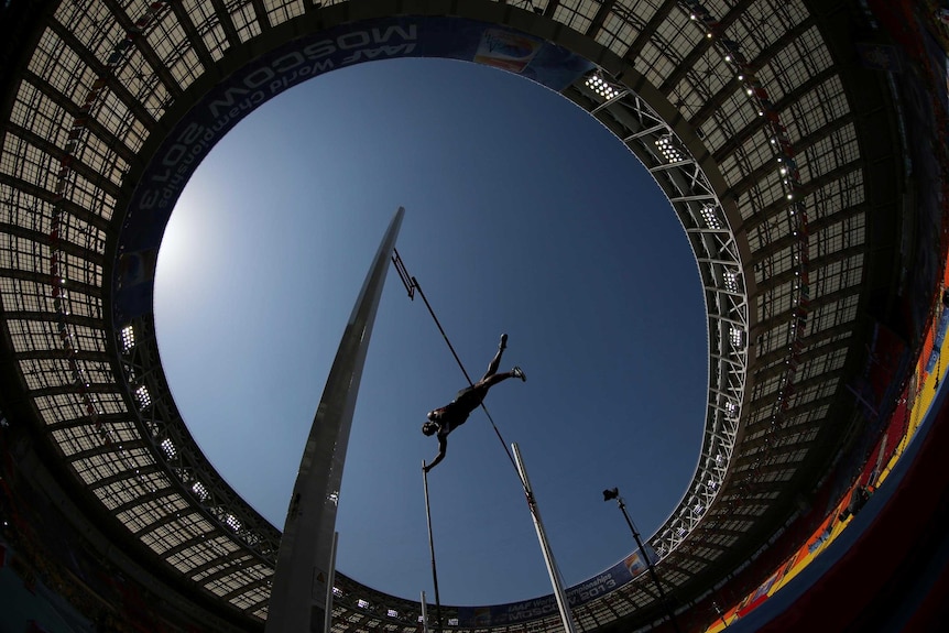 Damian Warner soars over the pole vault bar at the decathlon at the 2013 IAAF World Championships.