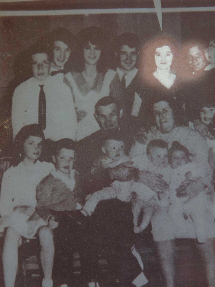 An old photo of Helen and her husband, parents, siblings and two children