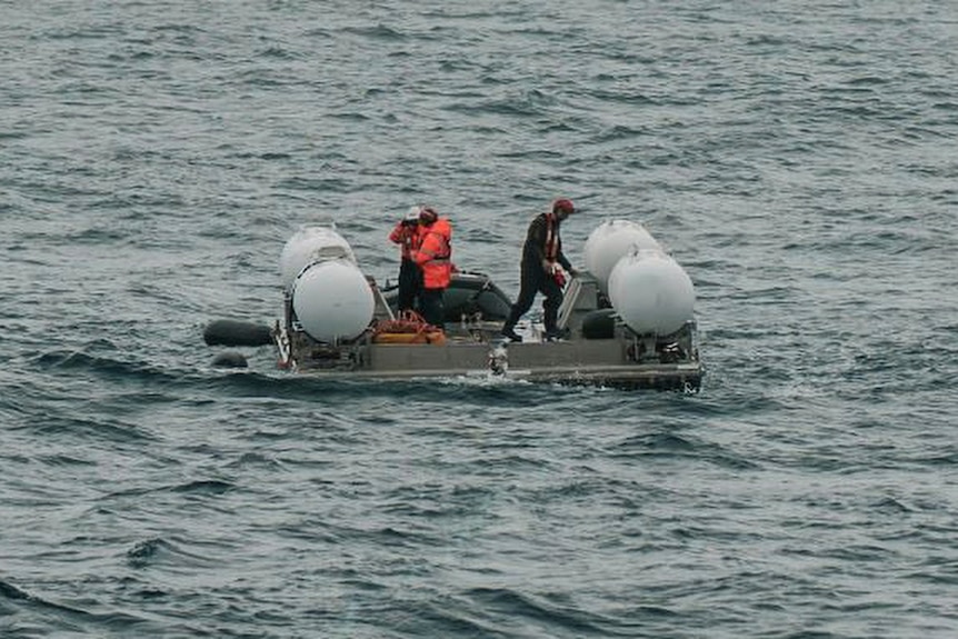 Four buoys are pictured with some sort of platform in between as the Titan is prepared for a dive.