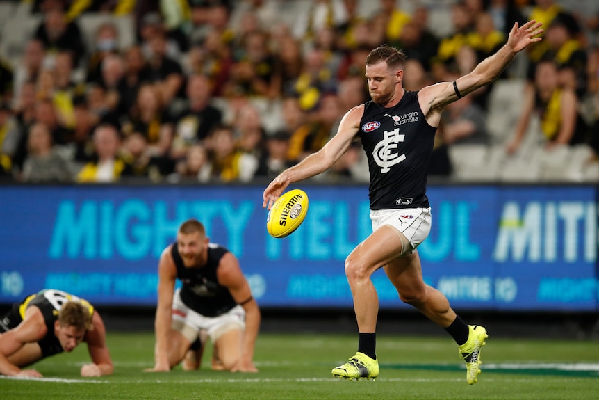 Sam Docherty of the Blues kicks the ball Round 1 AFL match