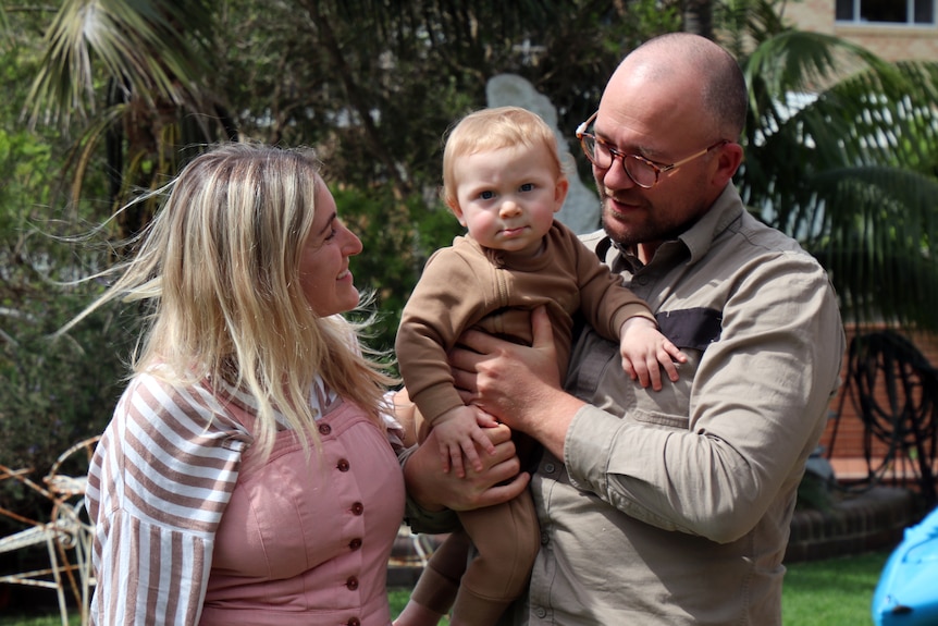 Casey and Michael Kirchhoff with their child.