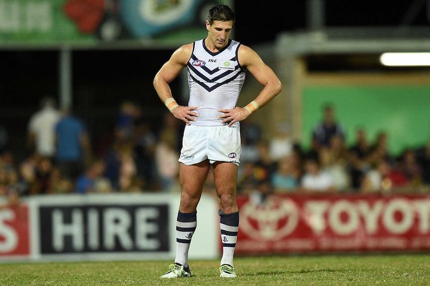 Matthew Pavlich looks downcast while standing on the pitch at TIO Stadium, Darwin.