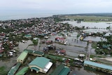 Floodwaters covering ground and roads caused by typhoon Vongfong are seen from the air.