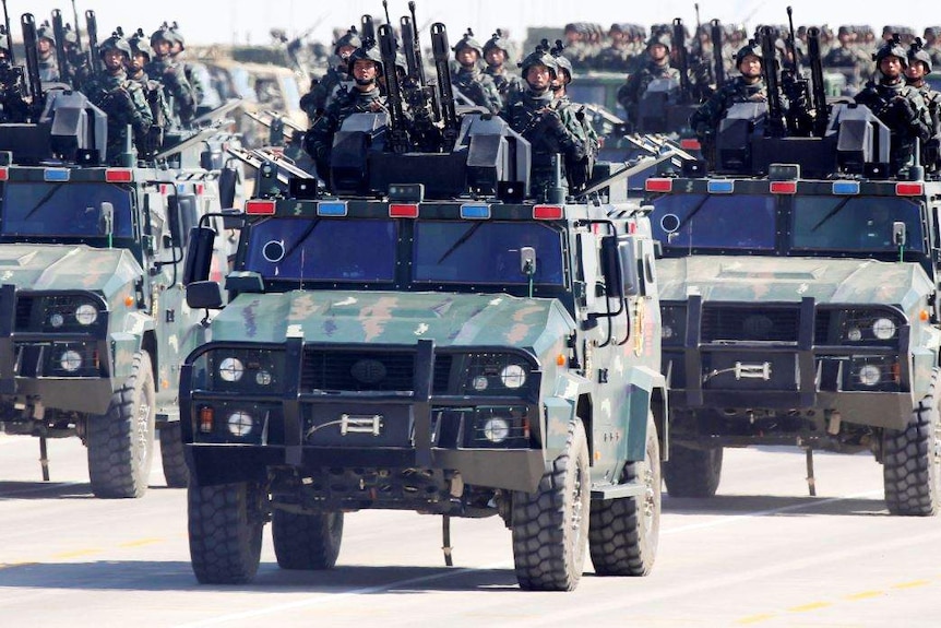 Soldiers of China's People's Liberation Army (PLA) take part in a military parade.