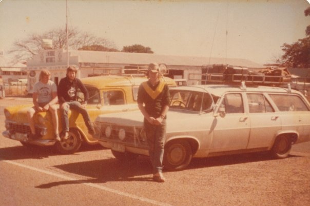 Dated photograph from 1979, three boys sitting on station wagons.