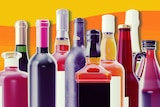 Various non-branded alcoholic beverage containers composed into a group for a story about short and long-term effects of alcohol