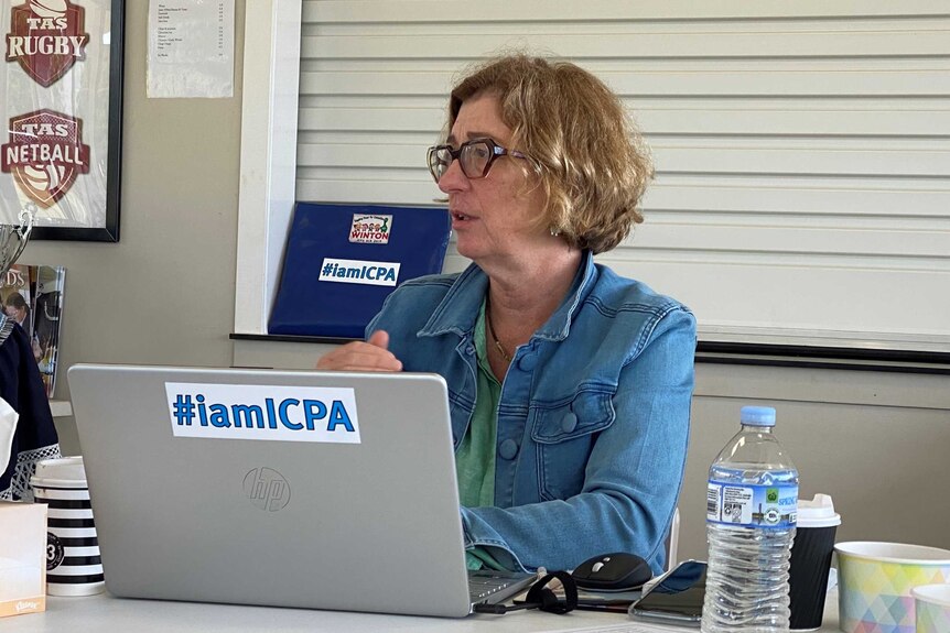 Queensland ICPA president Louise Martin speaking at a meeting in front of a laptop computer