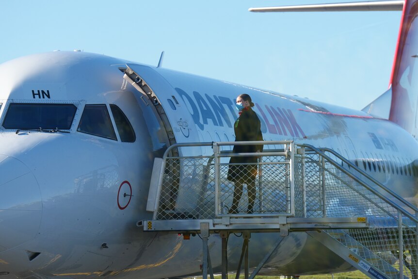 Qantas plane with flight attendant waiting