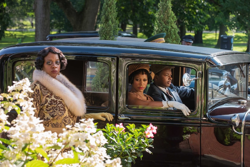 A scene from Ma Rainey's Black Bottom with Viola Davis about to step into a 1920s car