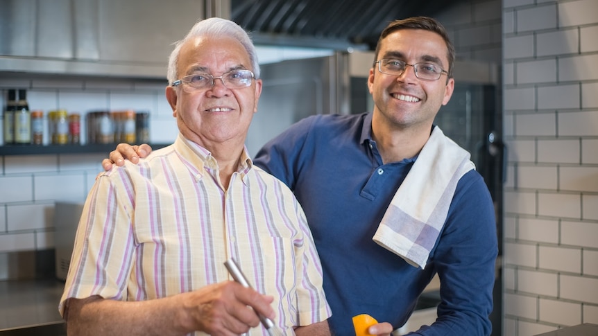 father-and-son-cooking-in-kitchen