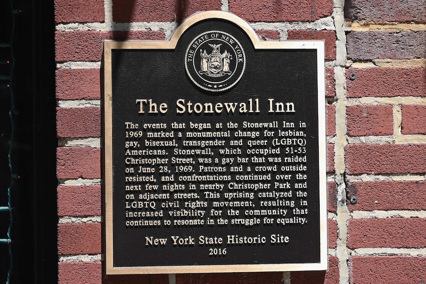 Plaque on a brick wall, explaining what happened at the Stonewall Inn in 1969