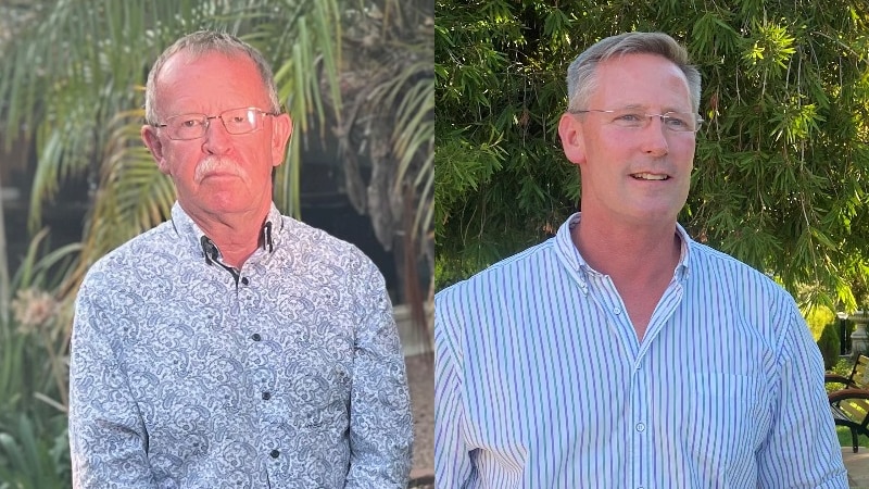 Two men wearing blue shirts