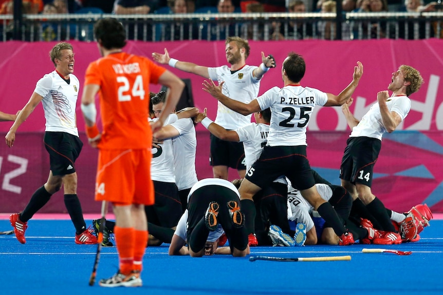 Germany celebrates defending its title by downing the Netherlands 2-1.