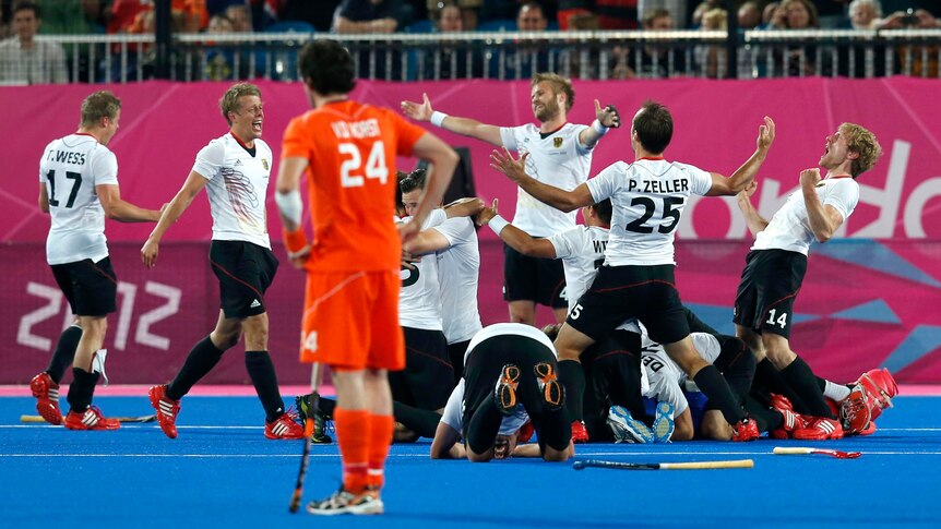 Germany celebrates winning gold against the Netherlands in the men's hockey.