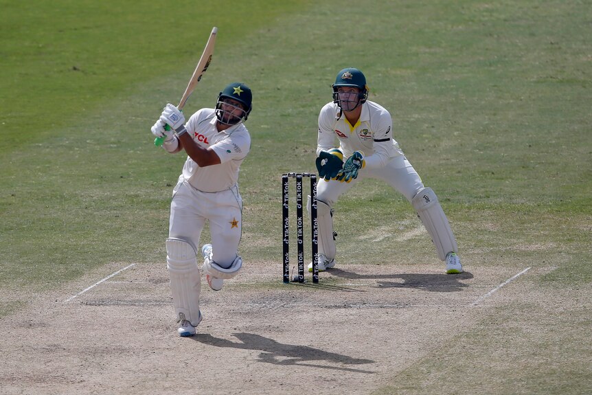 Imam-Ul-Haq completes a shot as wicketkeeper Alex Carey watches the ball fly away