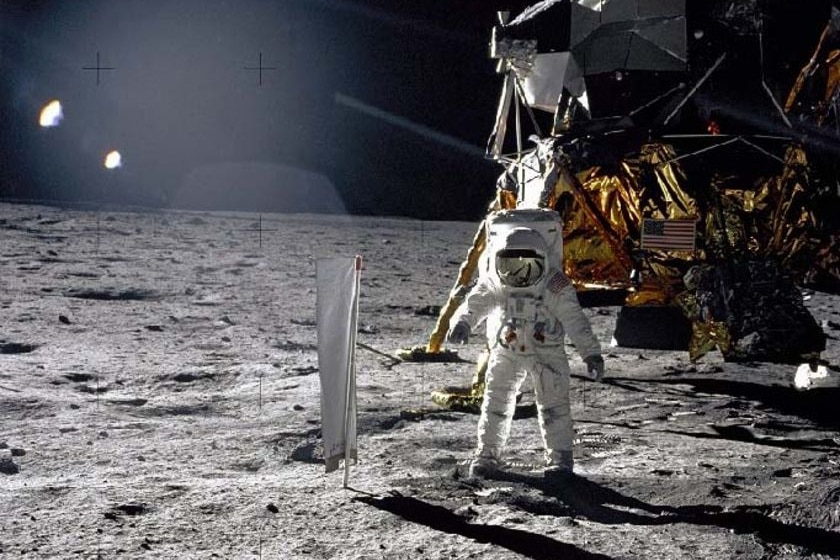 Bright sunlight glints and long dark shadows dramatize this image of the Moon surface.