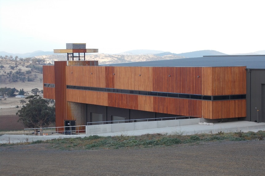 A wood-clad winery building.