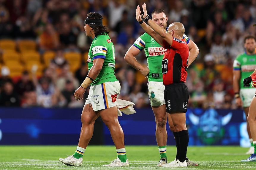 Referee Ashley Klein sends Canberra Raiders' Josh Papali'i to the sin-bin during an NRL game.