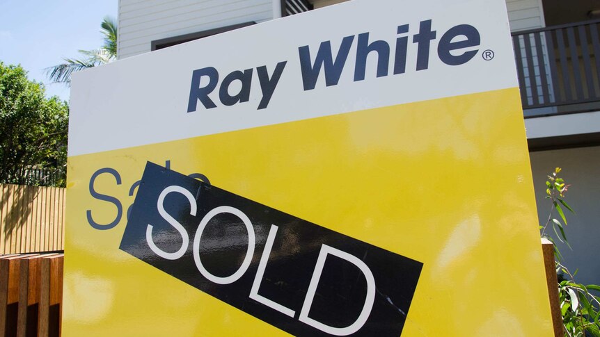 A Ray White 'Sold' sign outside a house in Brisbane