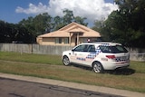 Police outside the Townsville home of Julie Hutchinson