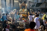 People pray at the Erawan shrine in Bangkok