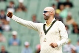 Nathan Lyon punches the air