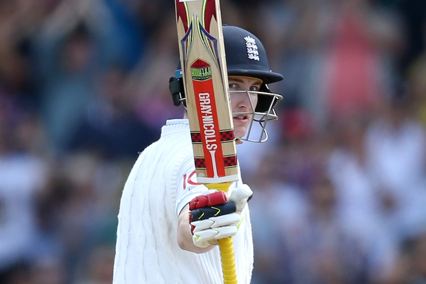 England batter Harry Brook holds his bat up after scoring a half-century at Headingley.