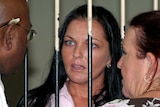 Australian Schapelle Corby speaks to her lawyer from a court cell