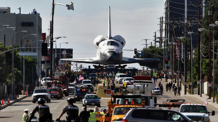 Space Shuttle Endeavour is transported on Manchester Avenue while being moved from Los Angeles International Airport.