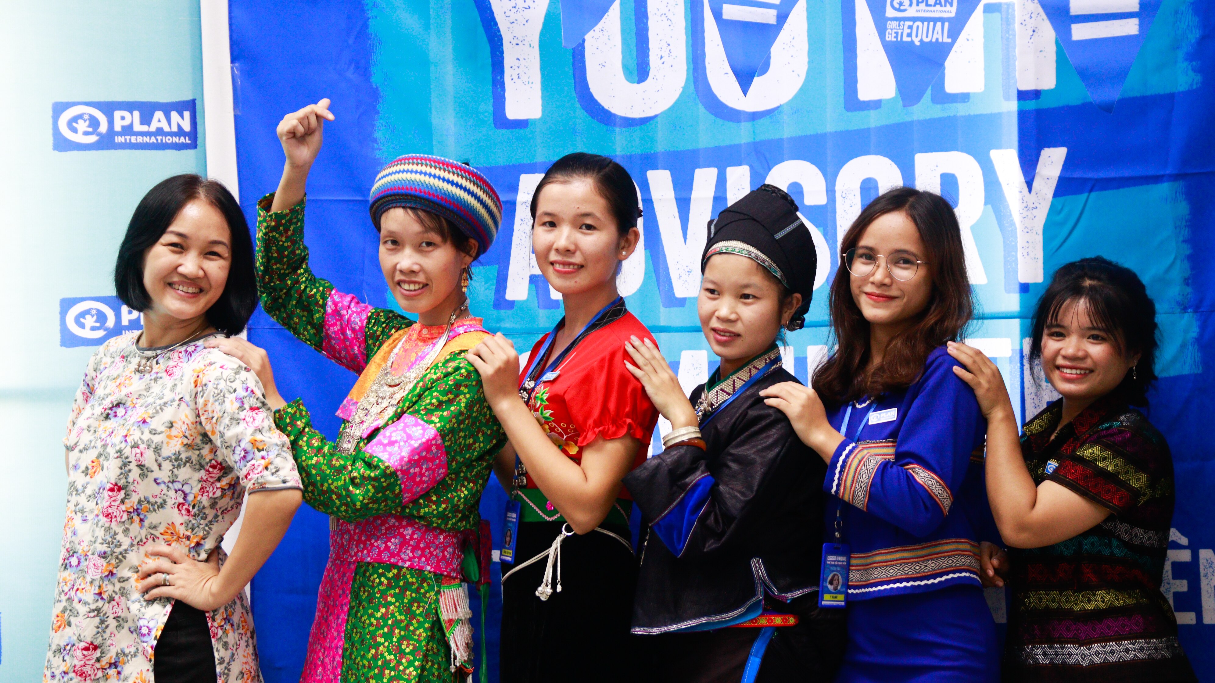 Mai, far left, wearing a traditional outfit, with other other Vietnamese ladies behind her.