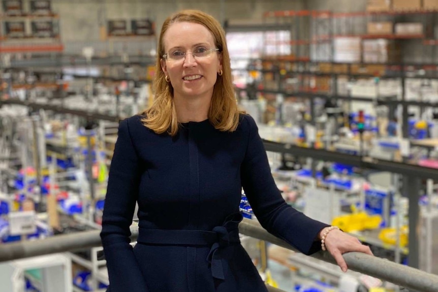 Jane Hunter, the CEO of Tritium, poses for a photo on the balcony at the company's factory.